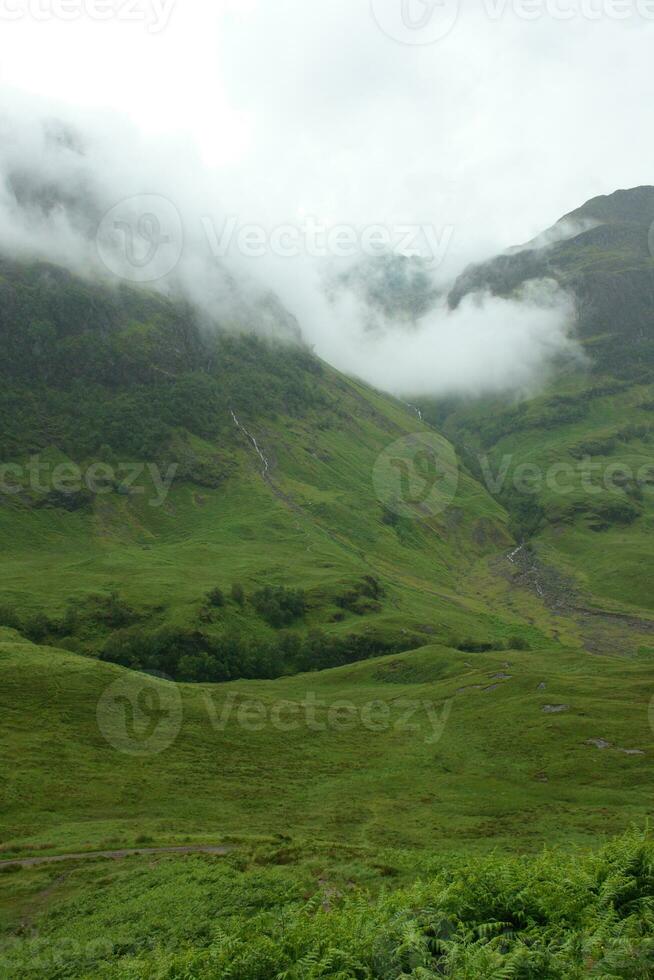 Fog and Rain on the Glencoe Mountain in Scotland photo