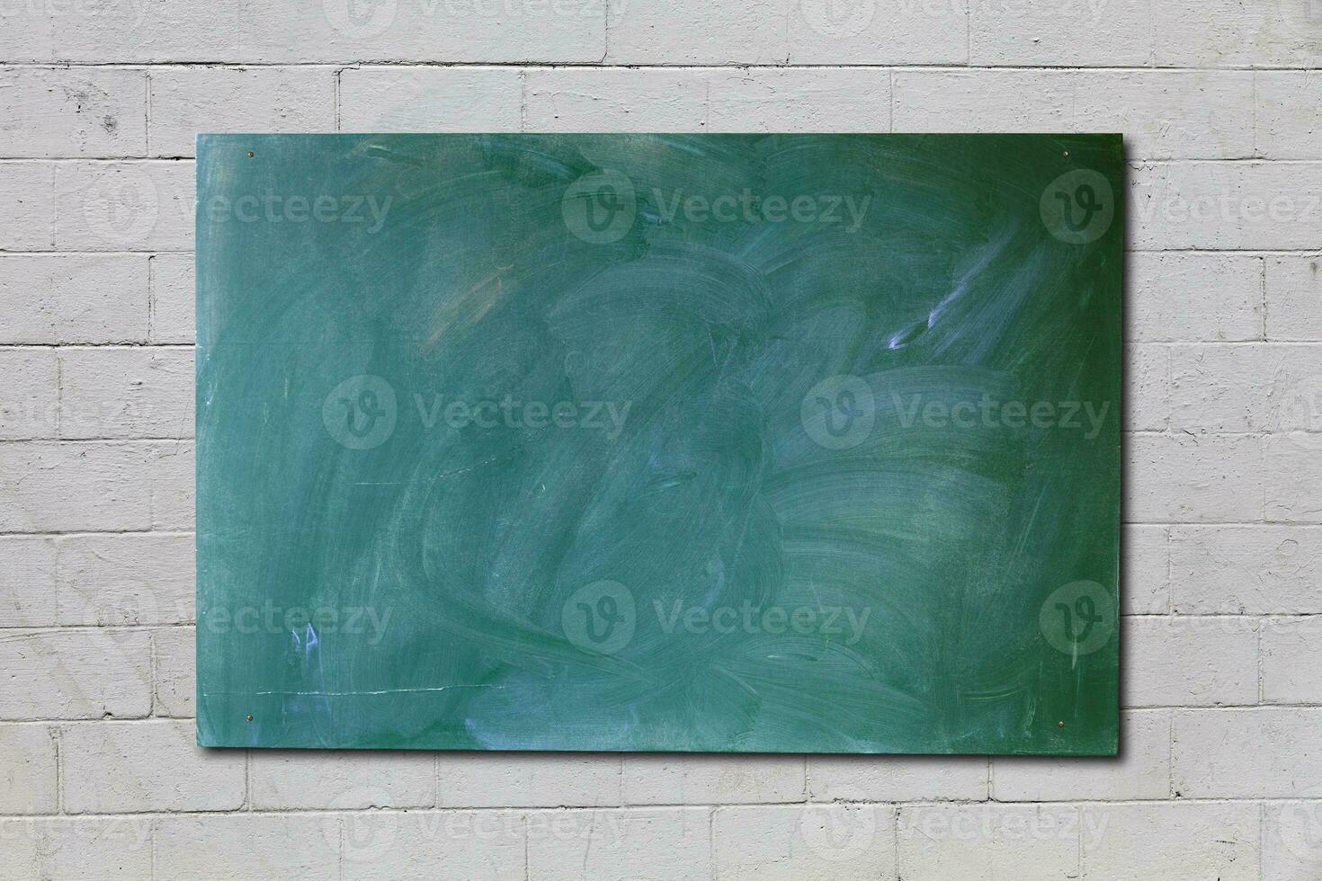 Blackboard screwed on a wall photo