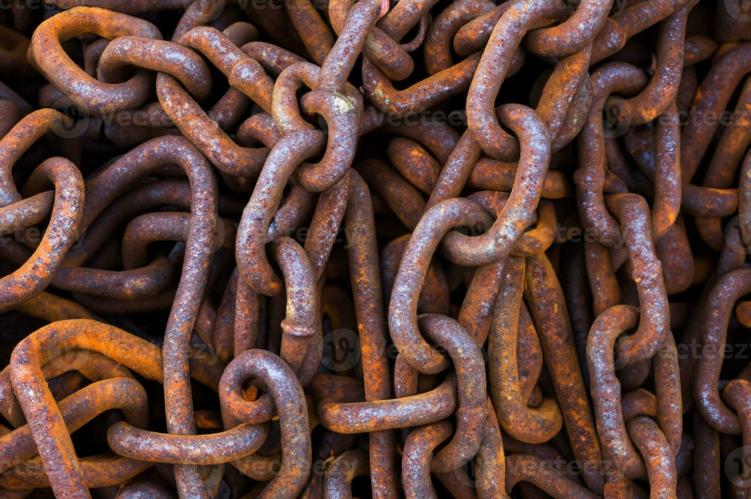 old rusty chain on the ground photo