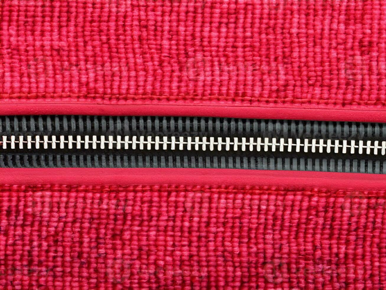 close - up of red fabric with black zipper. photo