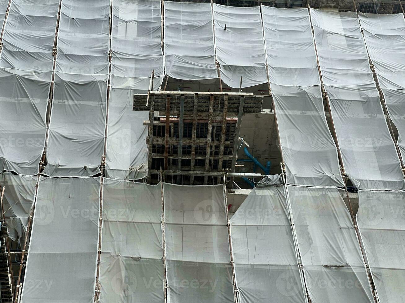 construction of an apartment building under a scaffolding. photo