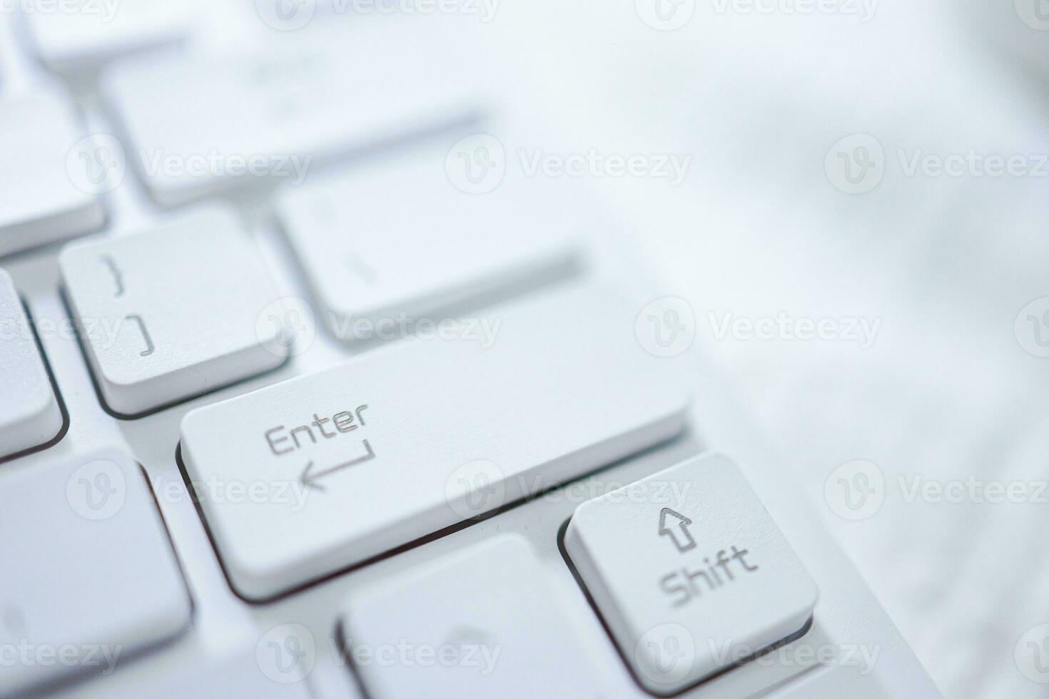 Hands of business woman Pressing enter button on computer keyboard photo