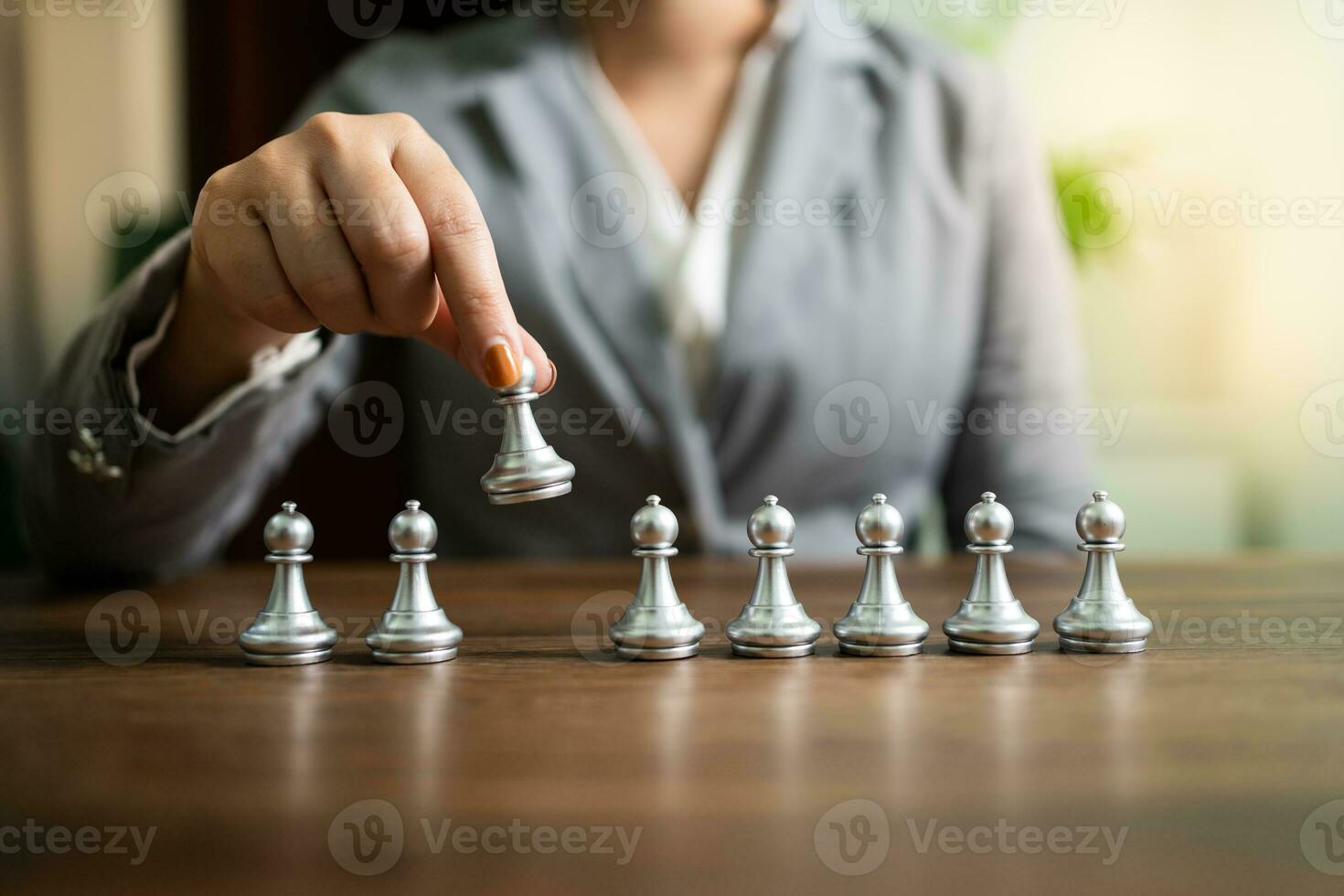 Human resources concept career management with clasped hands planning strategy with chess figures. HR department Search for employees by  inequality in the work collective photo