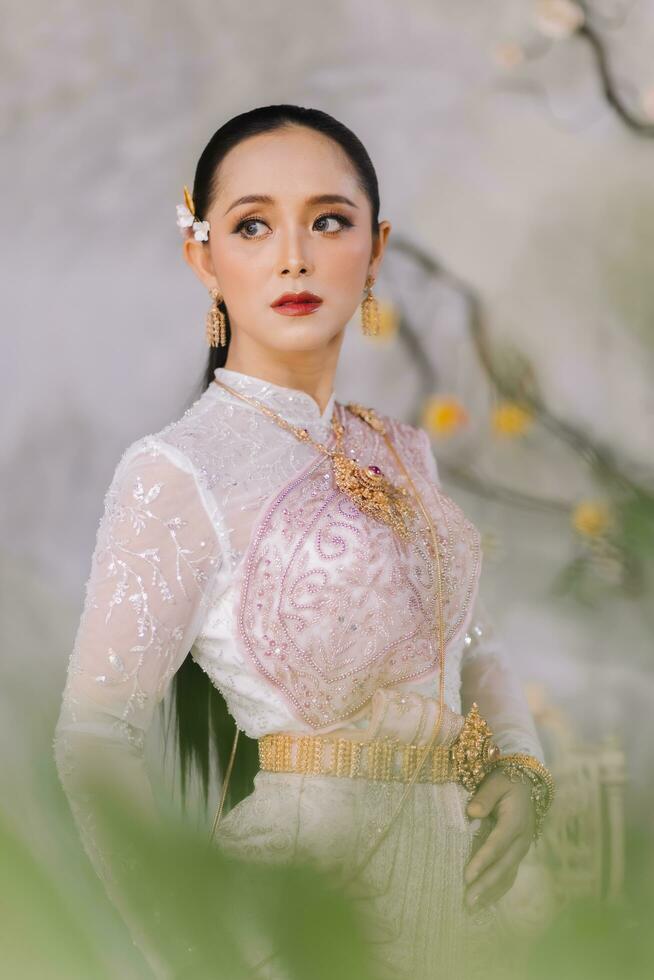 Beautiful Thai girl in Thai traditional costume.Bride Thai girl Beautiful. photo