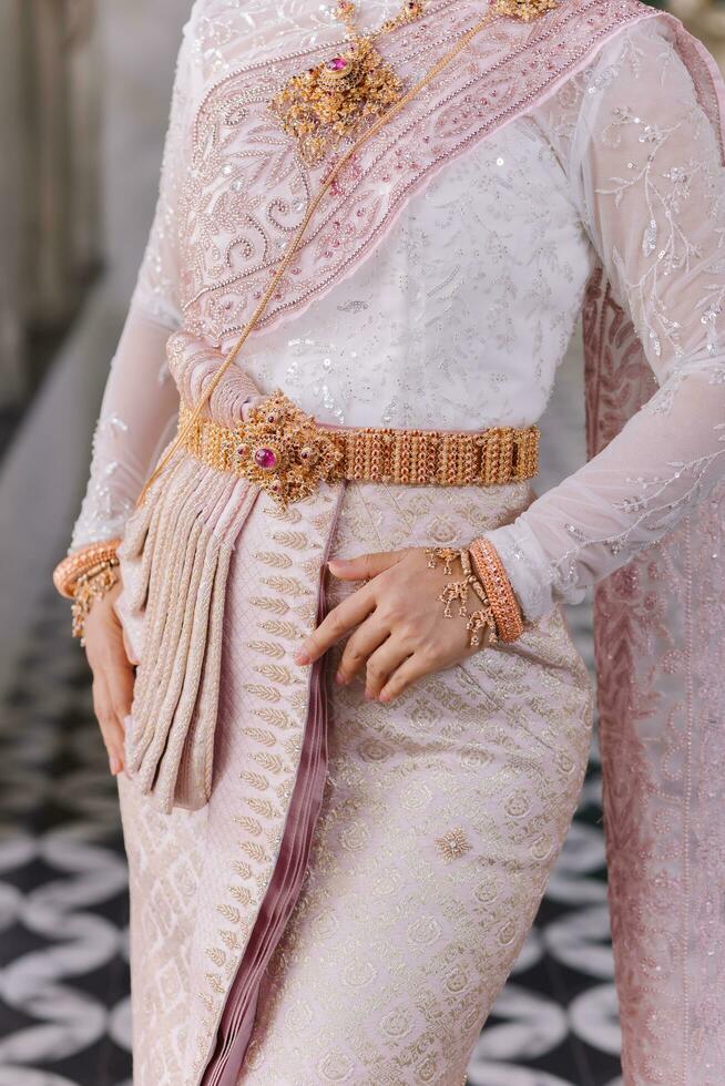 Beautiful Thai girl in Thai traditional costume.Bride Thai girl Beautiful. photo