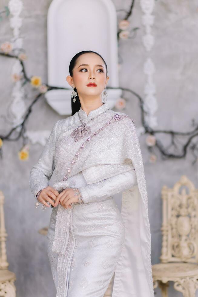 Beautiful Thai girl in Thai traditional costume.Bride Thai girl Beautiful. photo