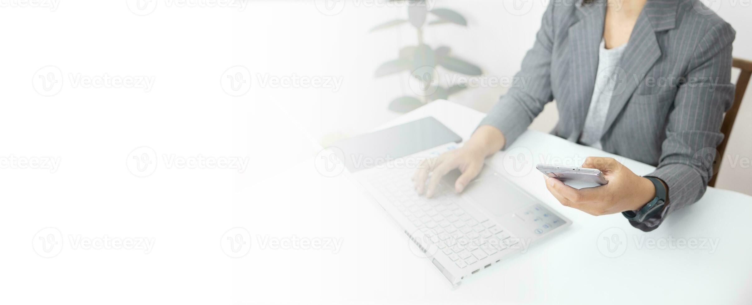 business woman looking the laptop or Notebook computer, personal working with laptop in the home office. photo