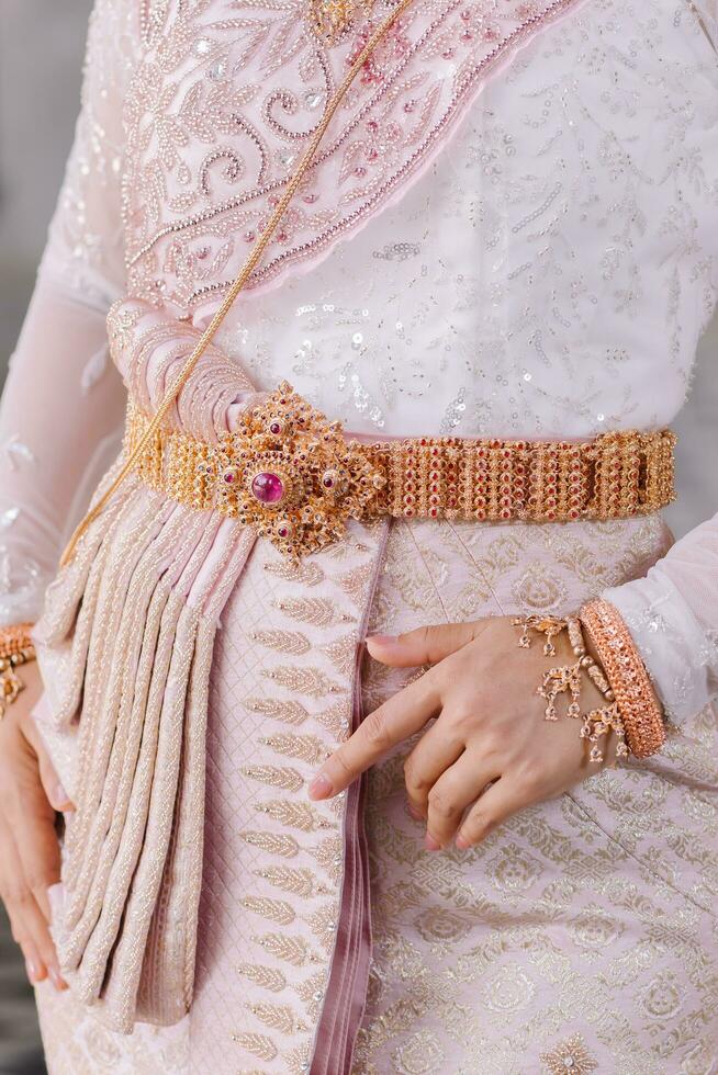 Beautiful Thai girl in Thai traditional costume.Bride Thai girl Beautiful. photo