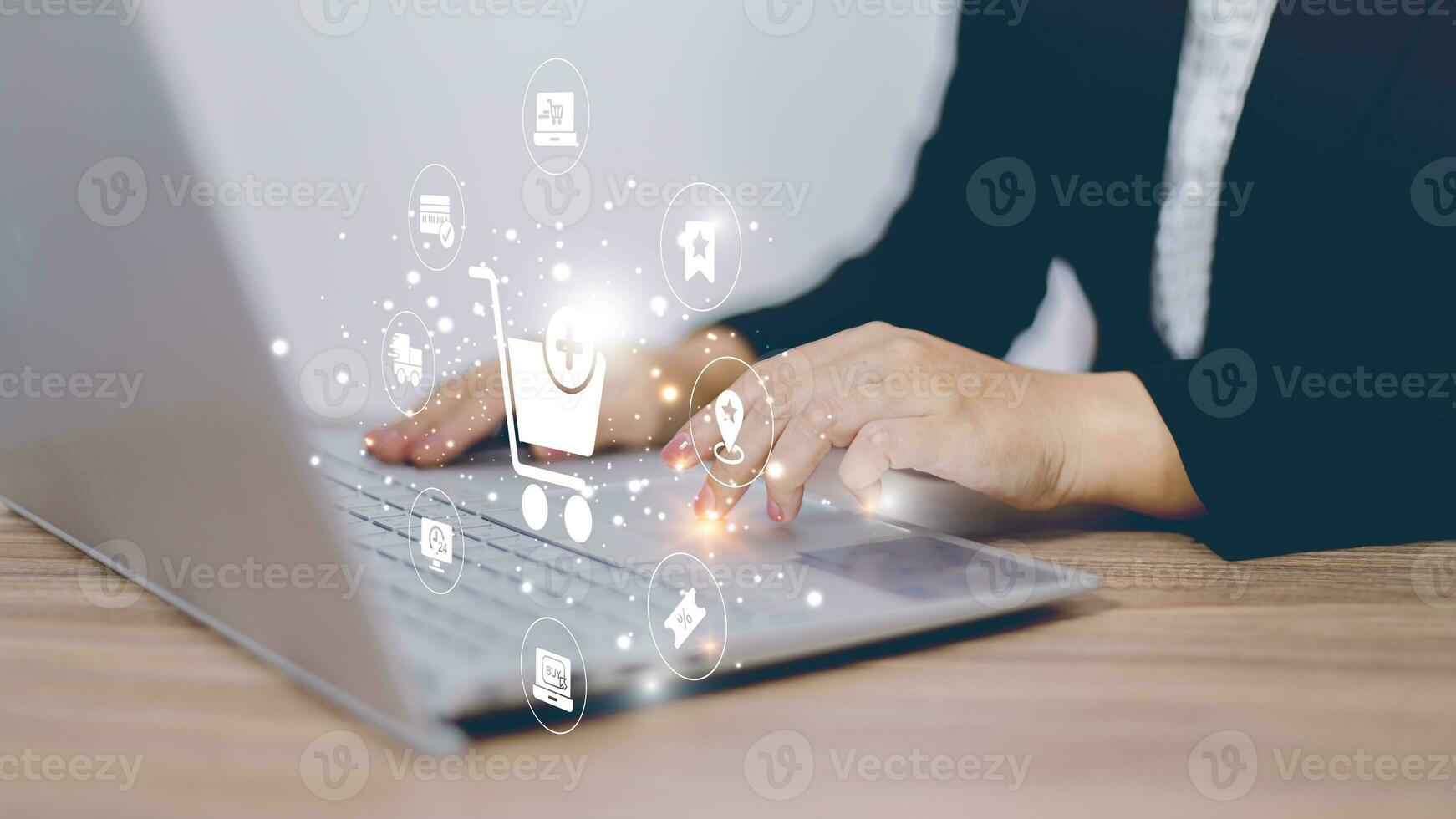 Businesswoman use mobile phone touching with virtual shopping trolley cart and e-commerce icons such as credit cart, delivery truck ,sale percentage for online shopping concept. photo