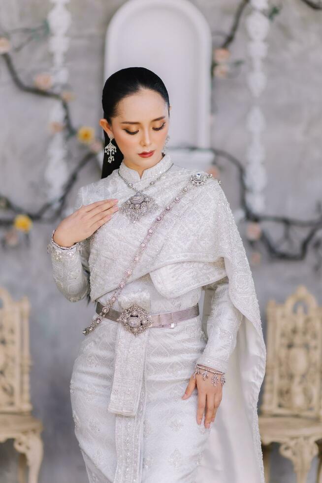 Beautiful Thai girl in Thai traditional costume.Bride Thai girl Beautiful. photo