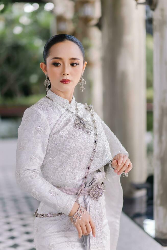 Beautiful Thai girl in Thai traditional costume.Bride Thai girl Beautiful. photo