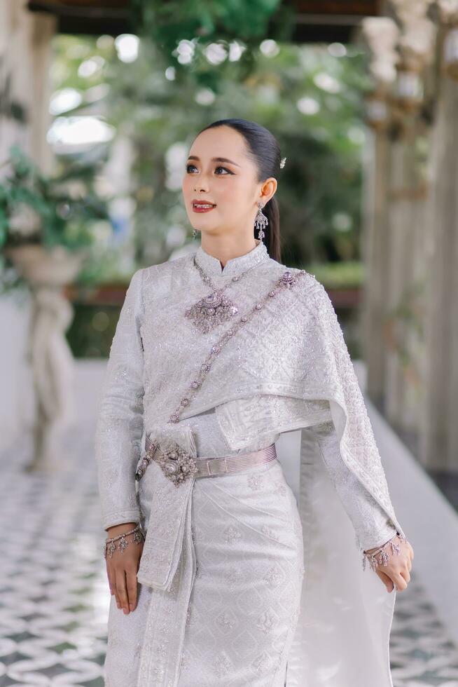Beautiful Thai girl in Thai traditional costume.Bride Thai girl Beautiful. photo