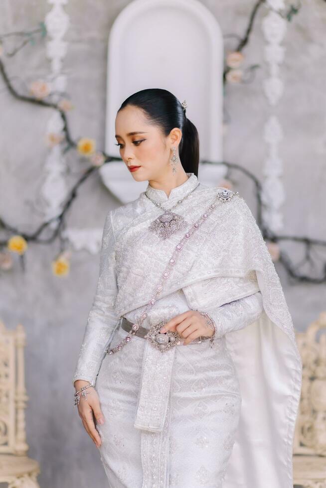 Beautiful Thai girl in Thai traditional costume.Bride Thai girl Beautiful. photo