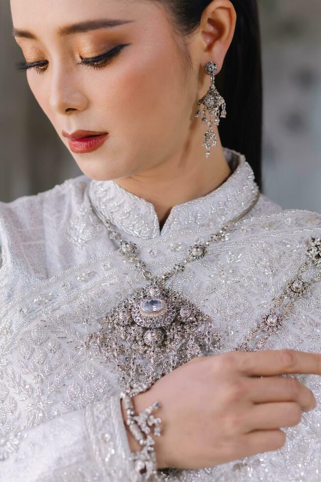 Beautiful Thai girl in Thai traditional costume.Bride Thai girl Beautiful. photo