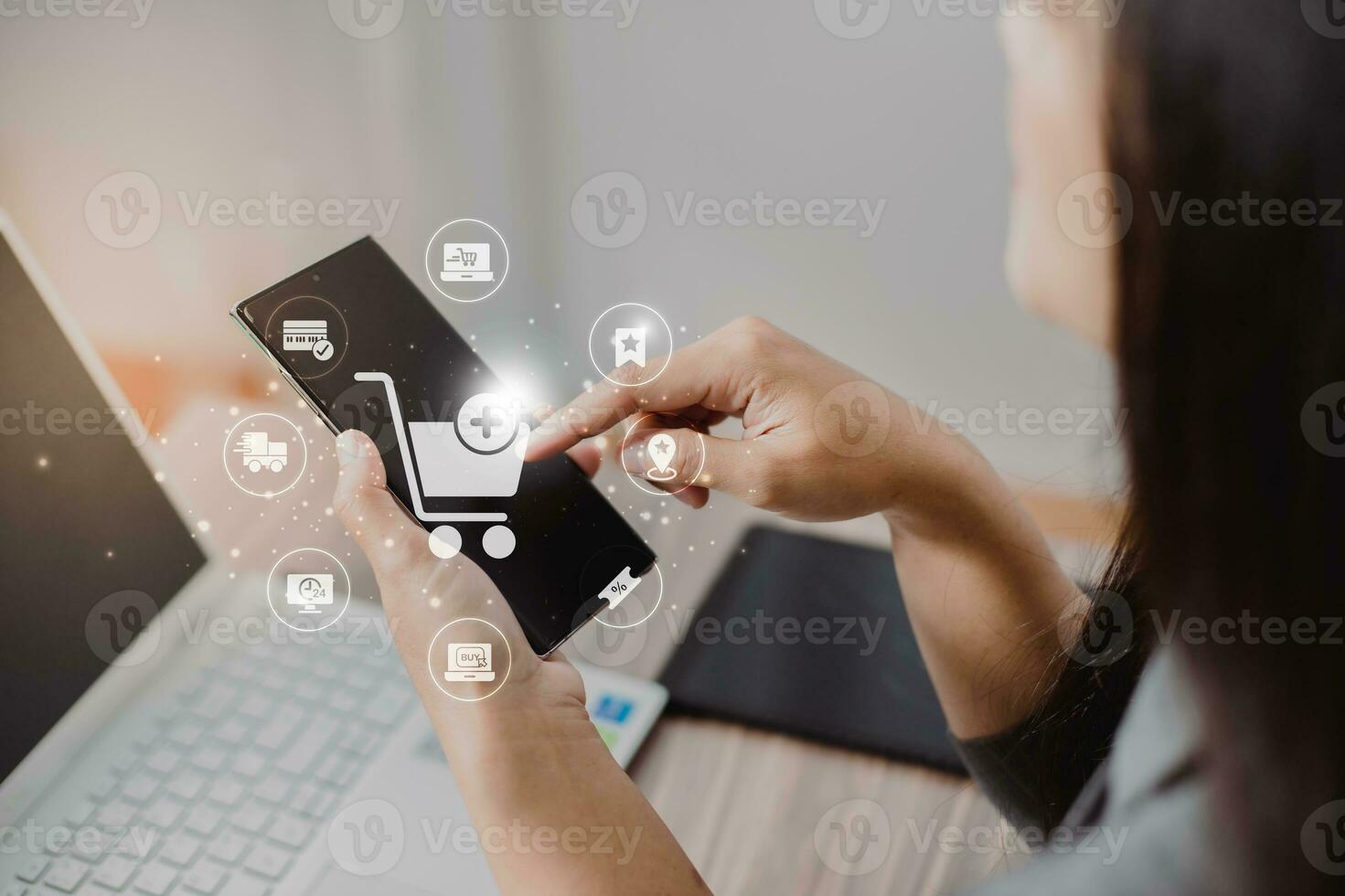 Businesswoman use mobile phone touching with virtual shopping trolley cart and e-commerce icons such as credit cart, delivery truck ,sale percentage for online shopping concept. photo