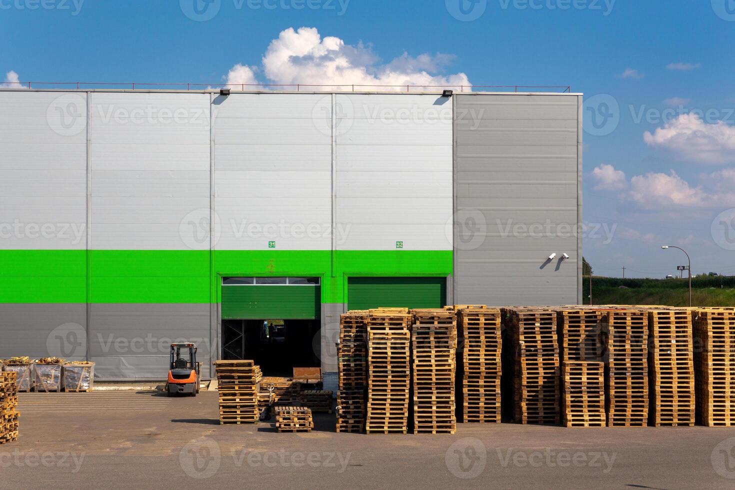 Wooden pallets heap in the cargo warehouse photo