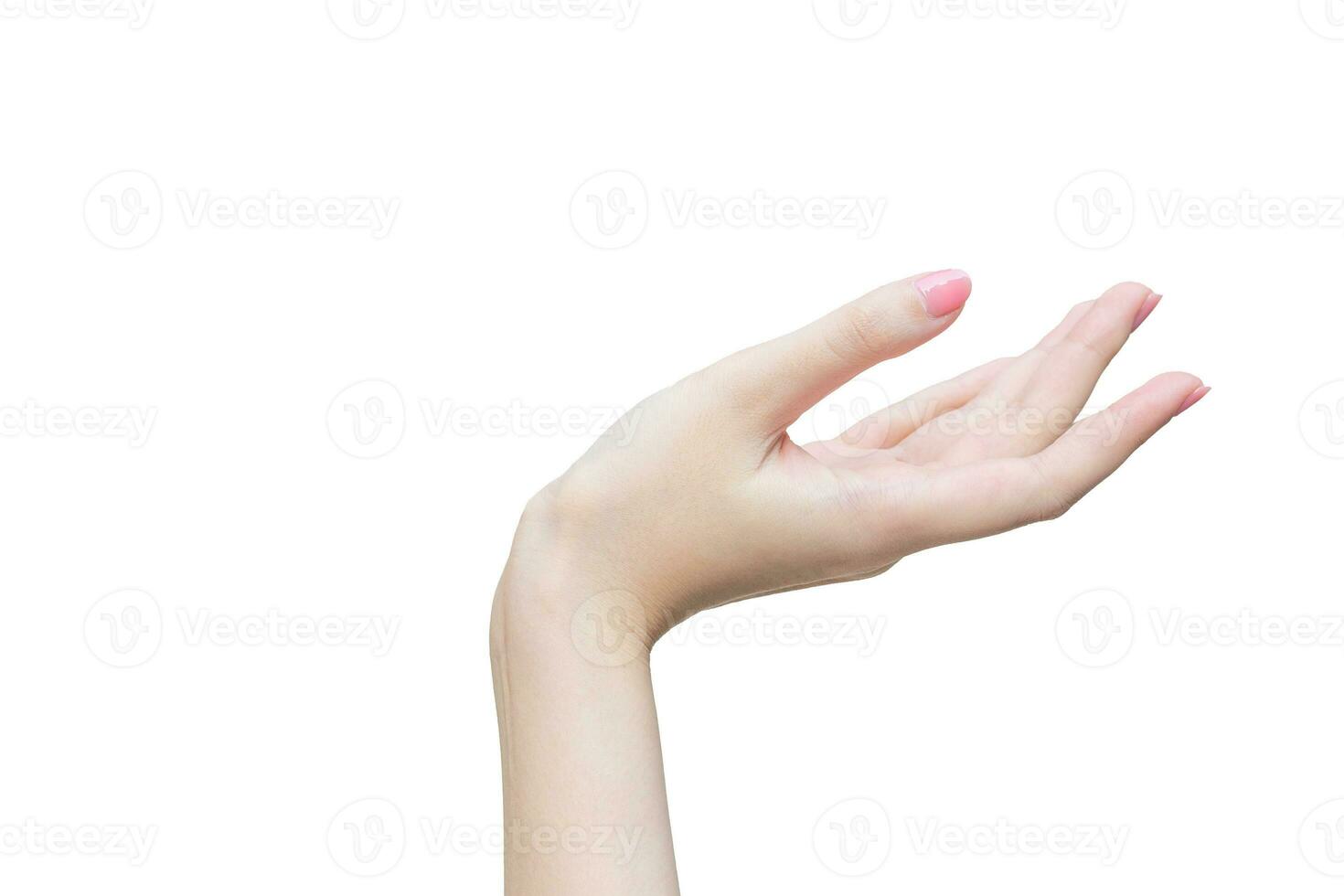 Beautiful female hand shows finger as pointing symbol in manicure concept to present something on the white background. photo