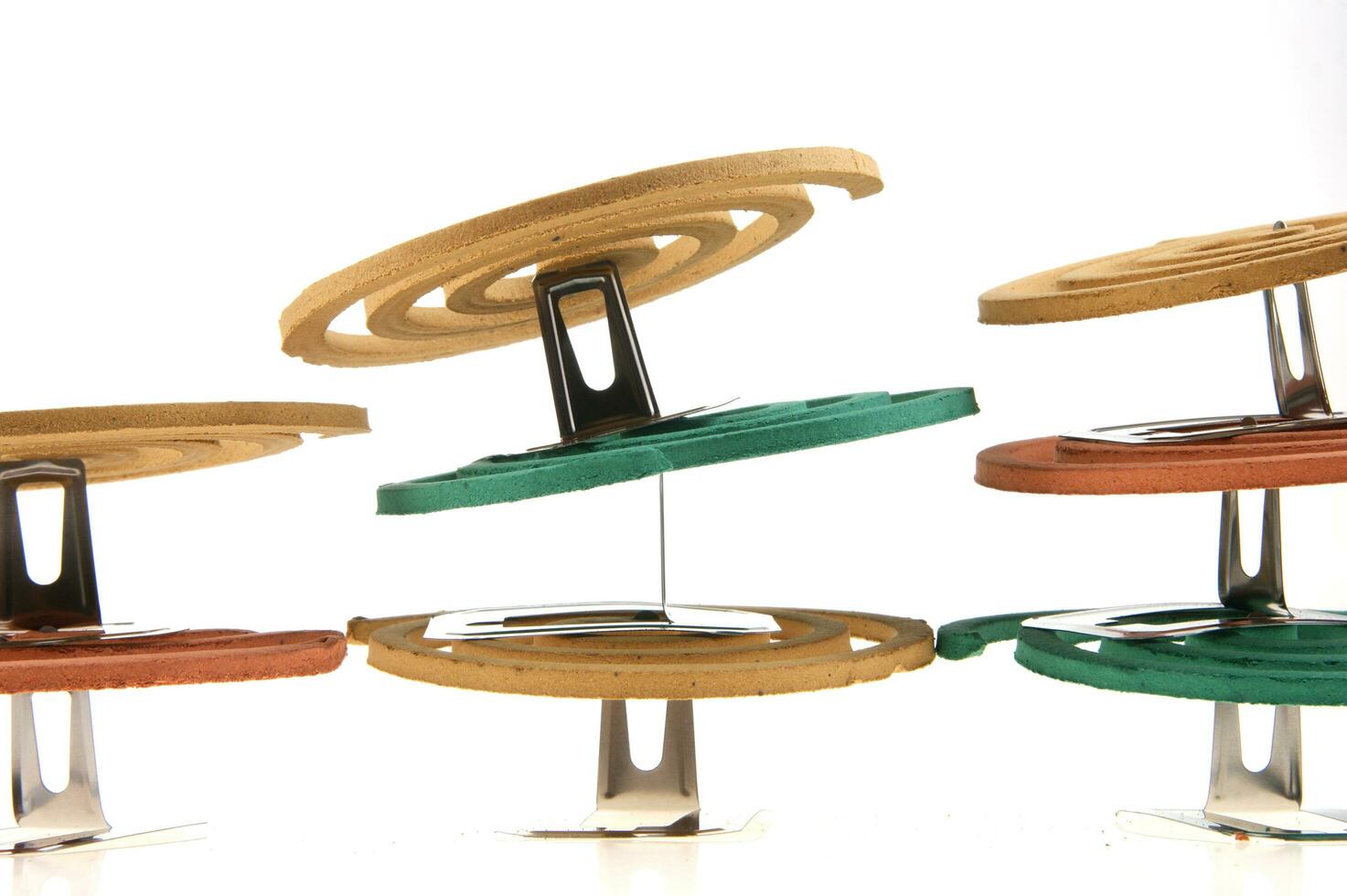 a group of colorful coasters with a spiral design photo
