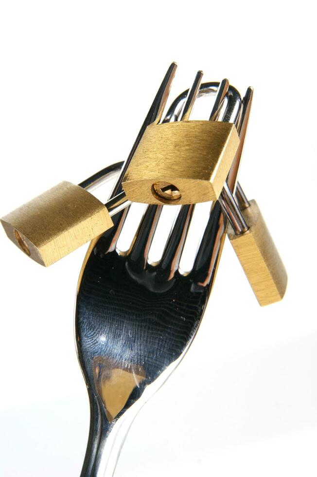 a fork, knife and spoon are arranged in a holder photo