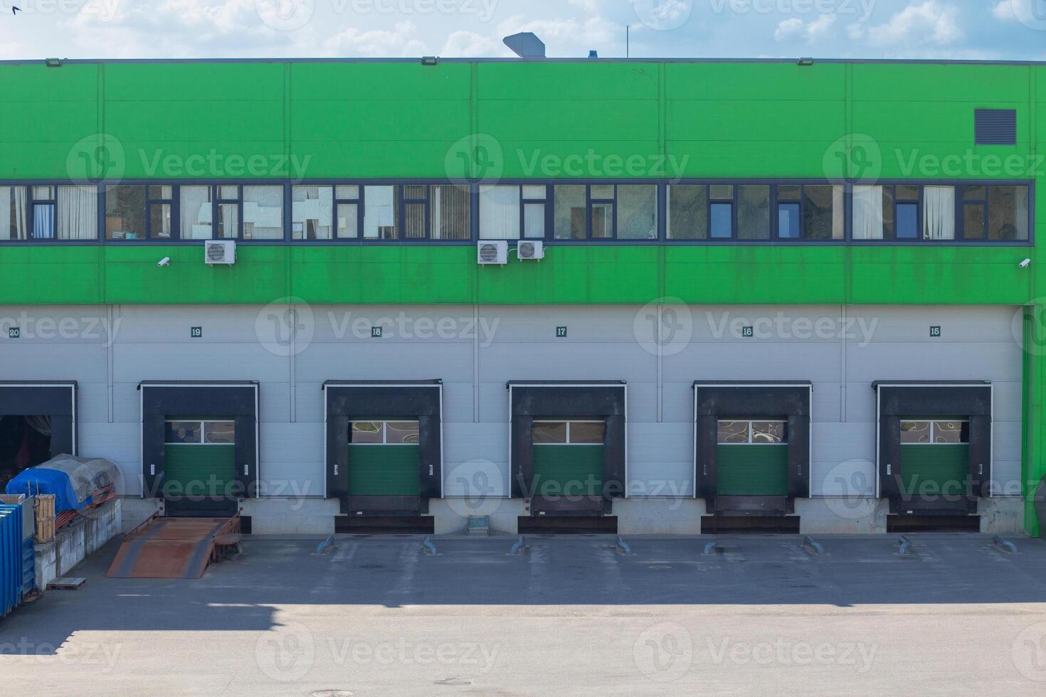 Row of loading docks with shutter doors. photo