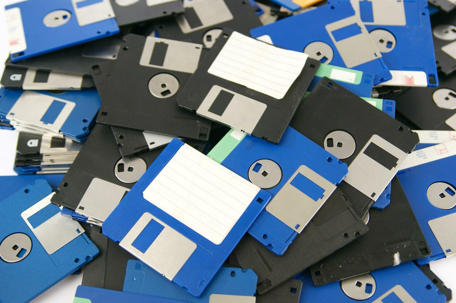 a pile of floppy disks photo