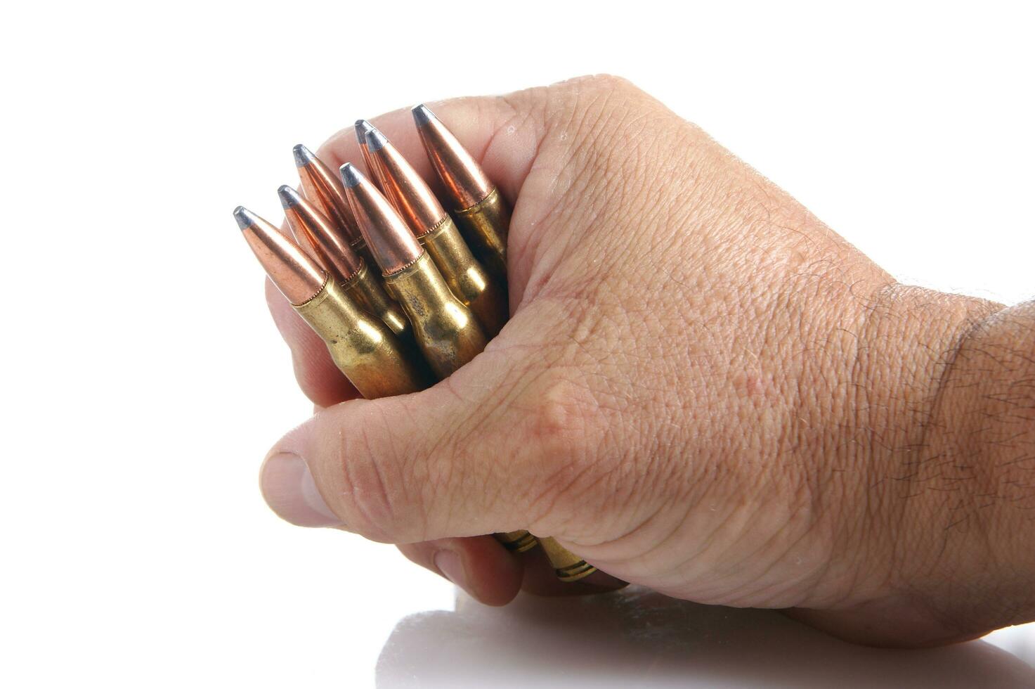 a row of bullet cartridges on a white background photo