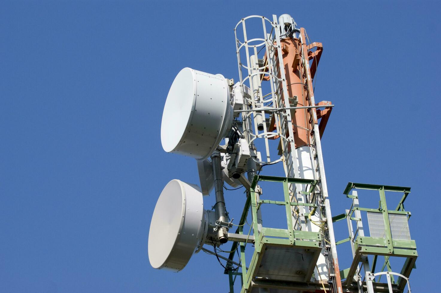 a cell phone tower with two antennas photo