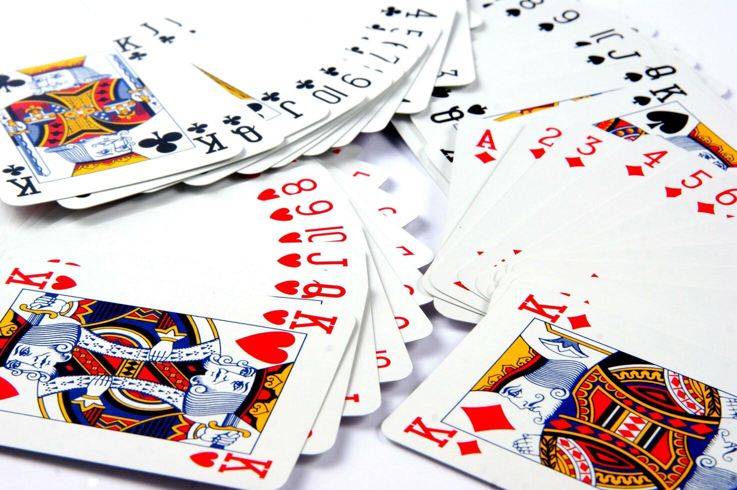 a pile of playing cards on a table photo