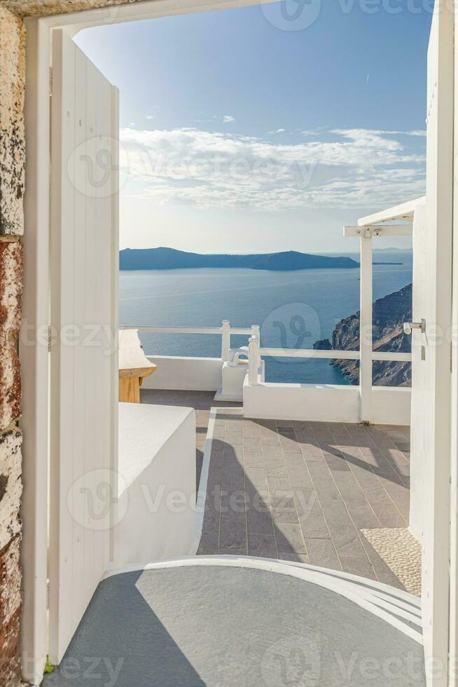 Amazing evening view of Fira, caldera, volcano of Santorini, Greece with cruise ships at sunset. Cloudy dramatic sky landscape, vertical panoramic banner. Beautiful summer sunset vacation scenery photo