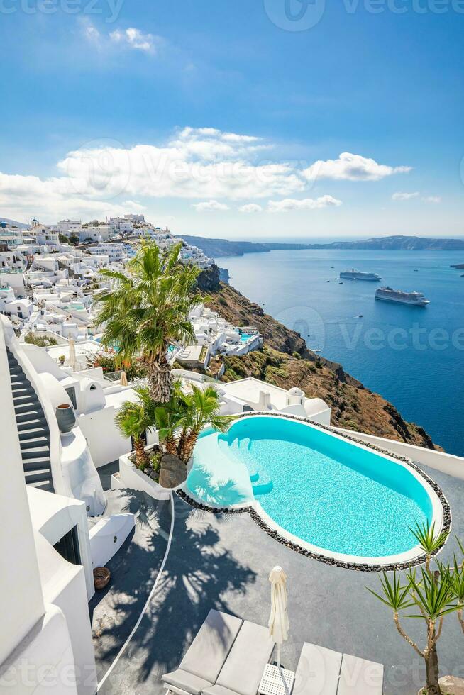 Swimming pool with sea view. White architecture on Santorini island, Greece. Beautiful landscape with sea view. Luxury summer travel and vacation background, vertical banner photo