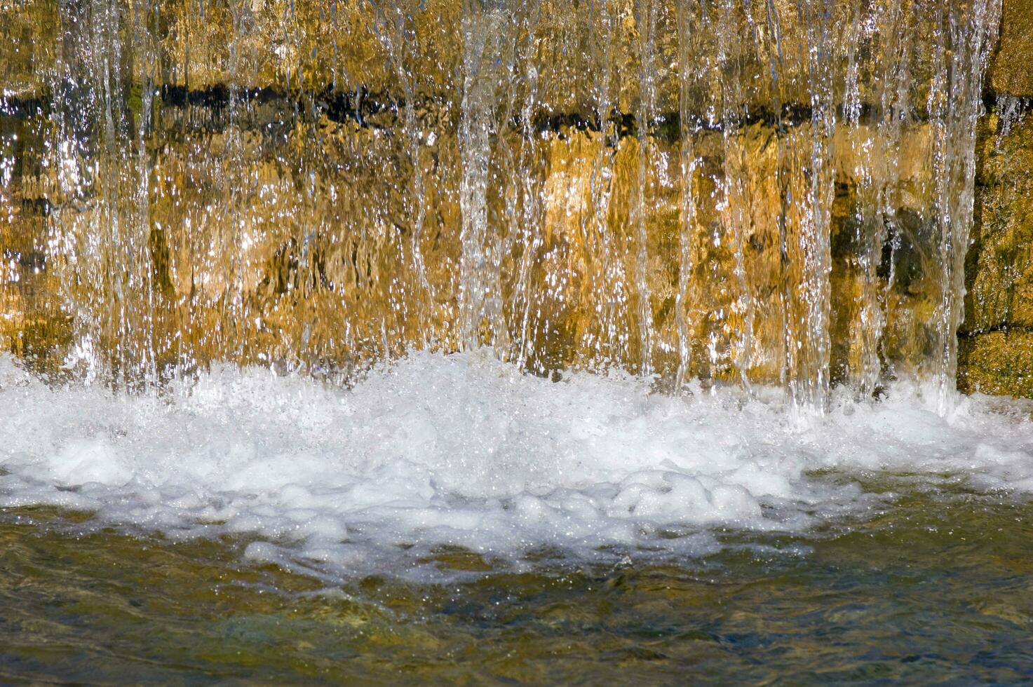 a man is standing on a water slide photo