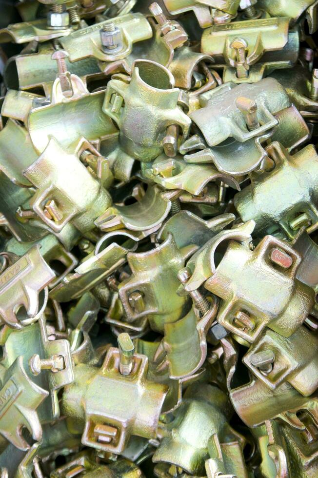a pile of metal clips and nuts in a pile photo