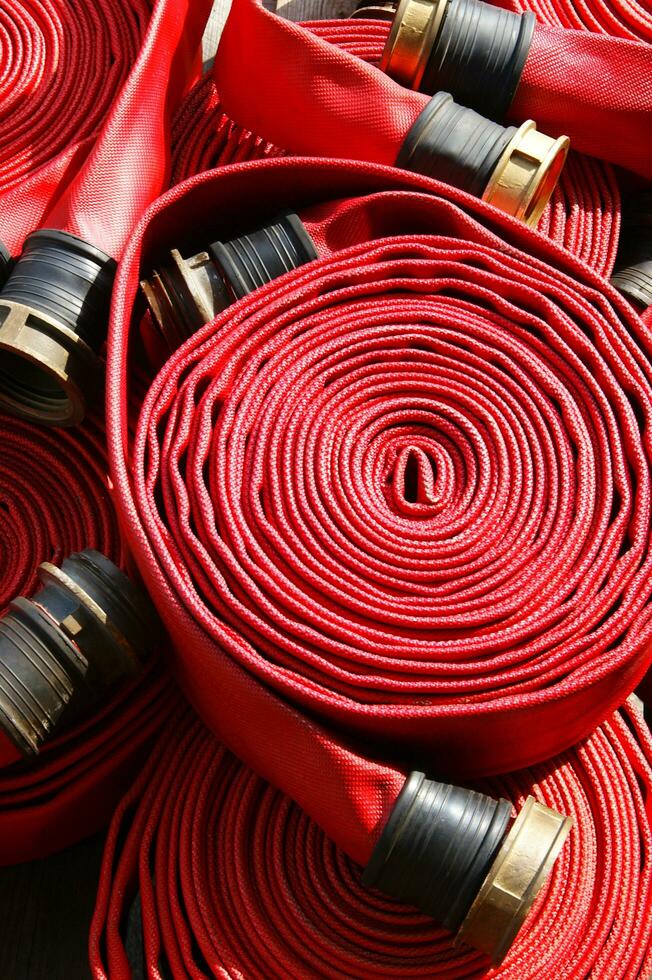 a close up of a red fire hose photo