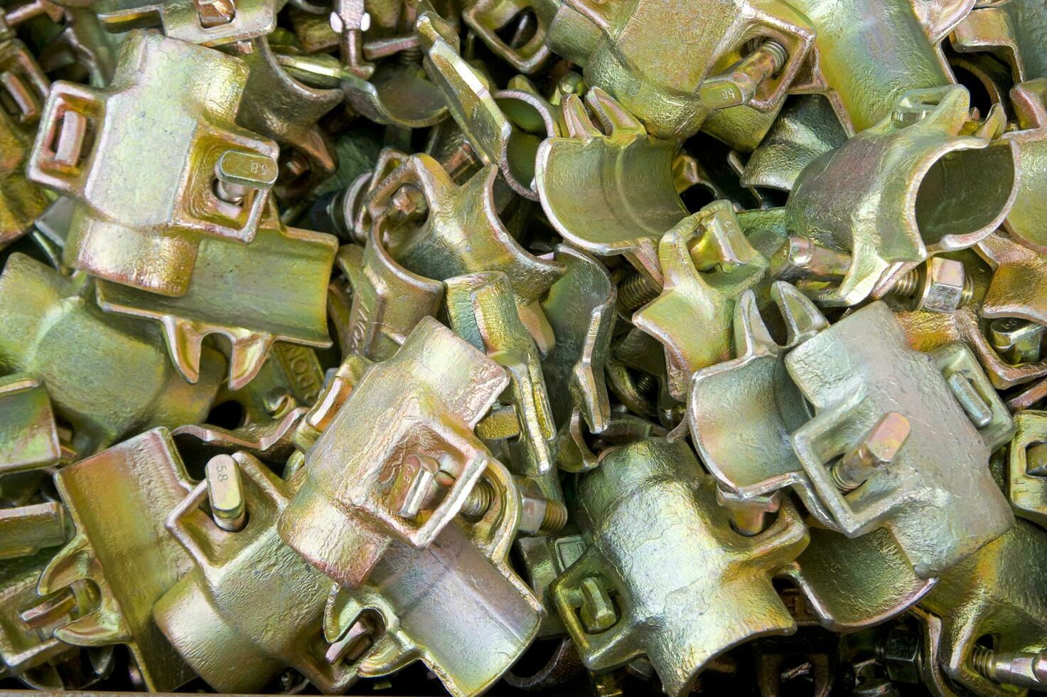 a pile of metal clips and nuts in a pile photo