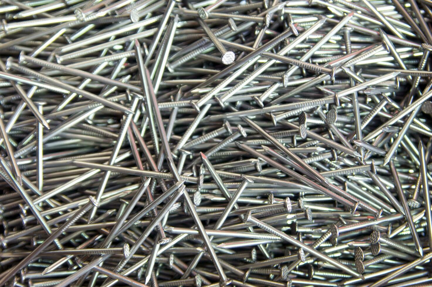 a pile of nails with a variety of sizes photo