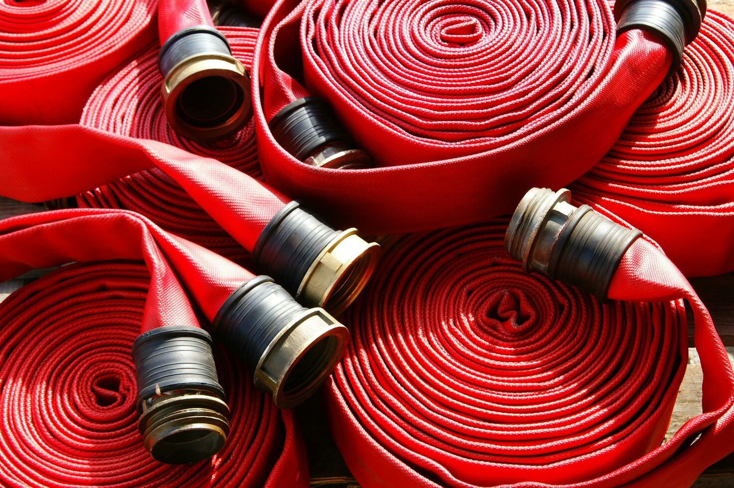 a close up of a red fire hose photo
