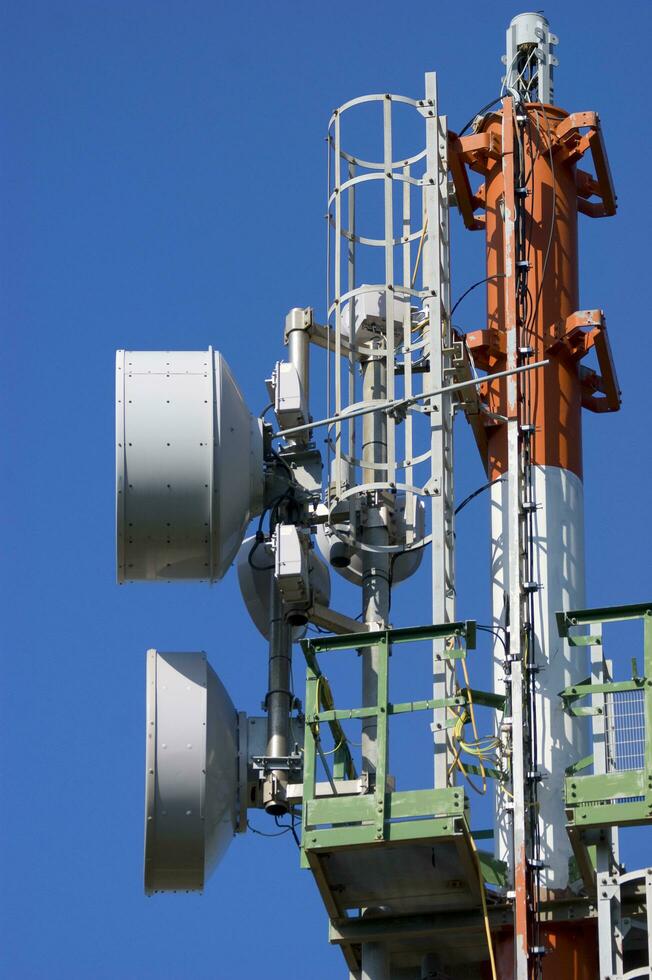 a cell phone tower with two antennas photo