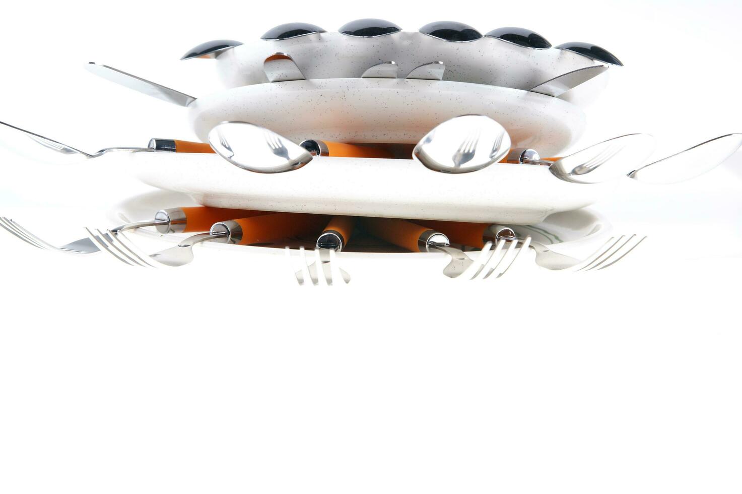 a stack of plates with spoons on top photo