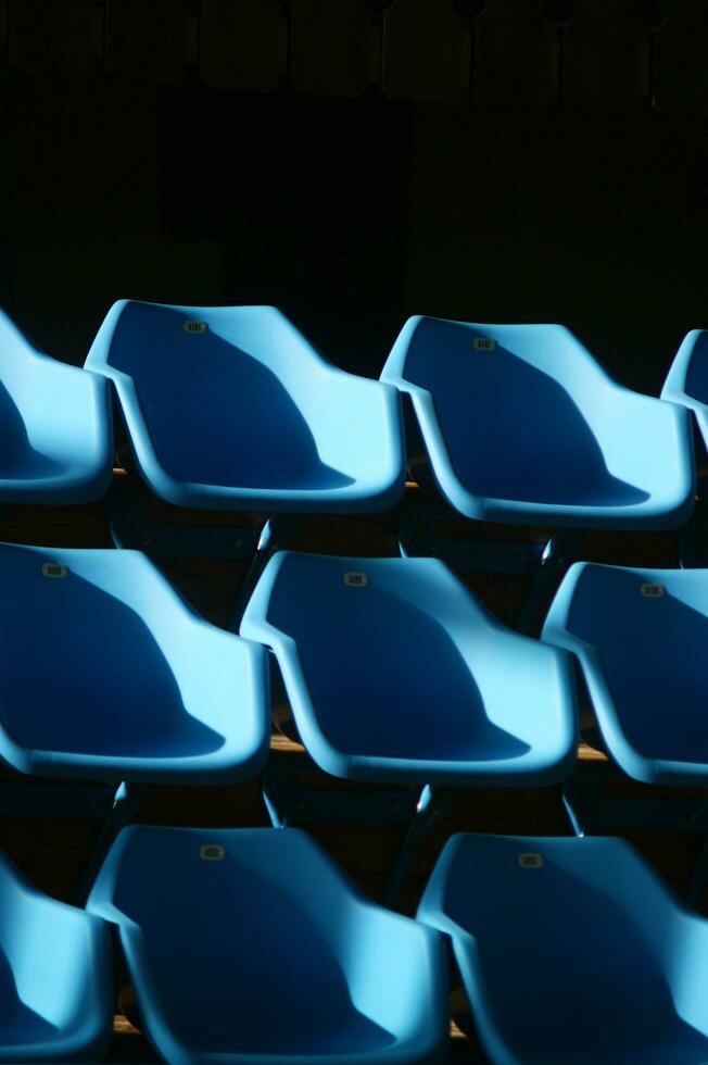 a row of blue chairs photo