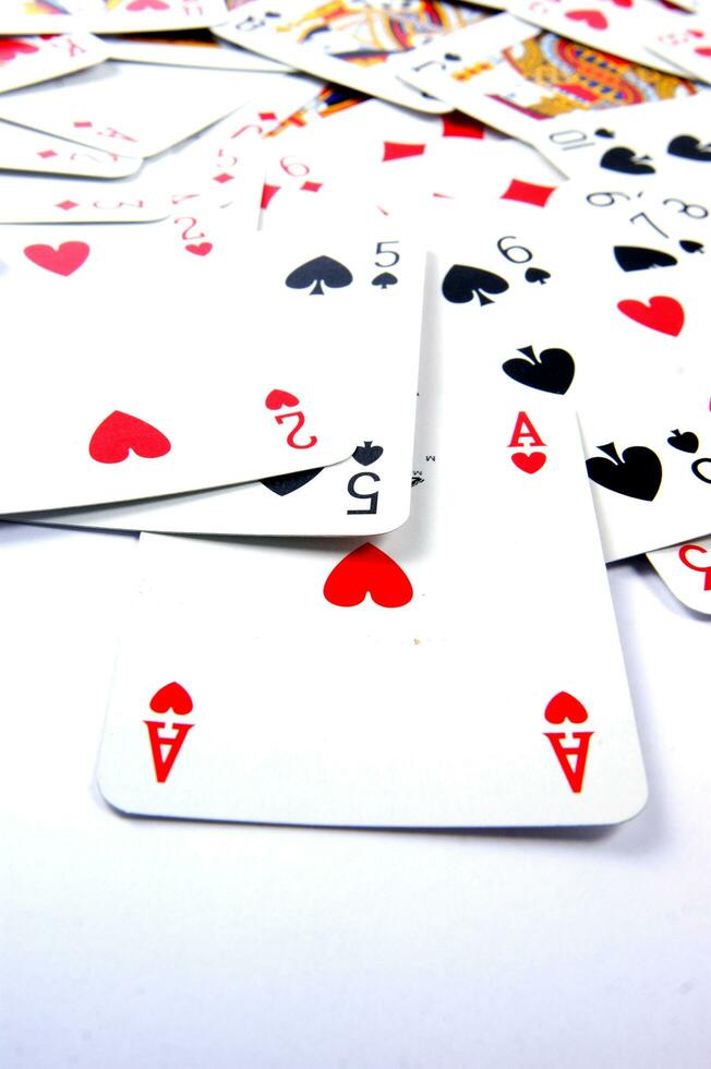 a pile of playing cards on a table photo