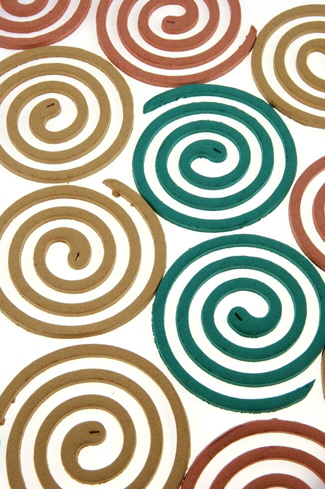 a group of colorful coasters with a spiral design photo