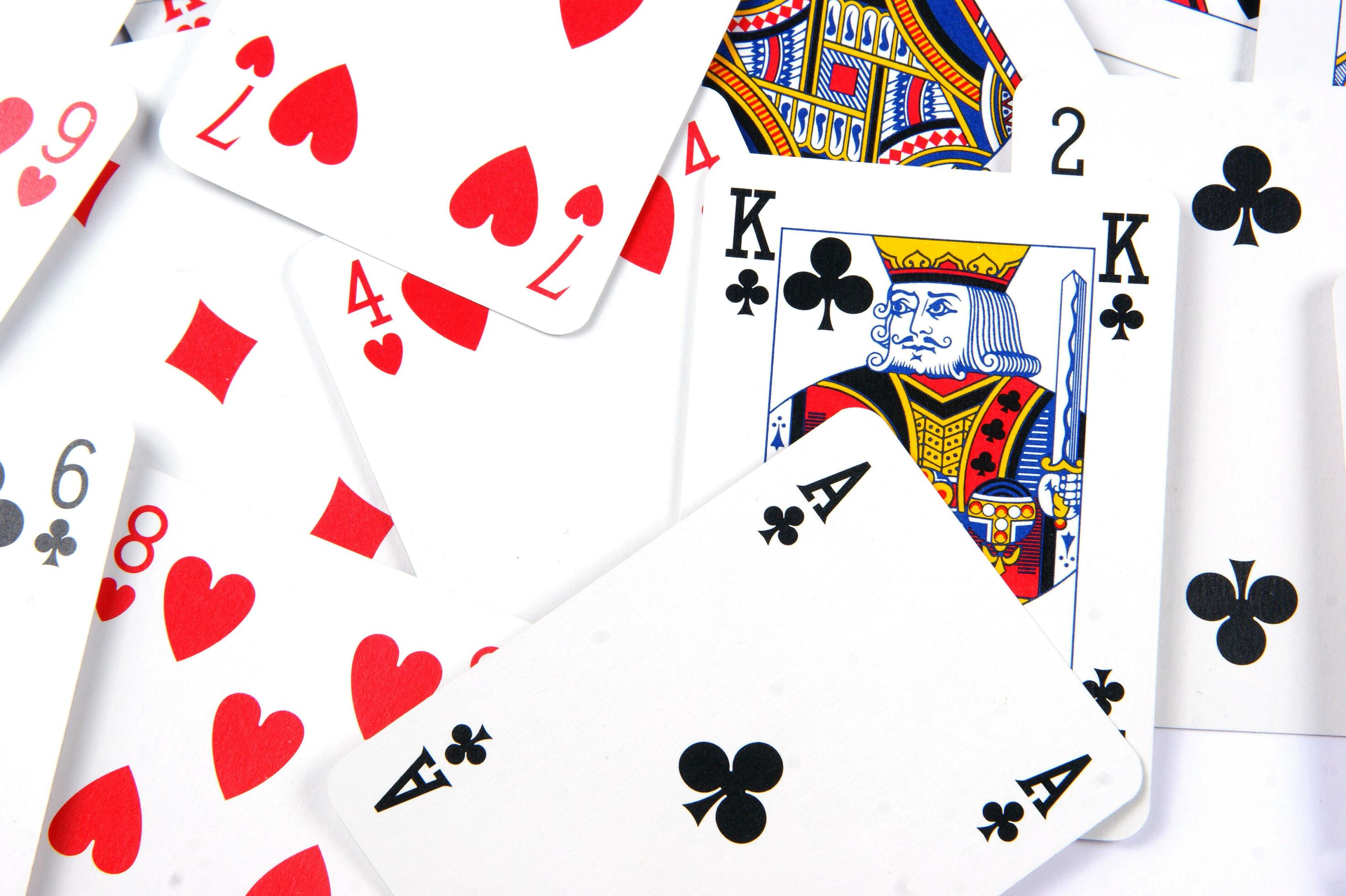 a pile of playing cards on a table 30752683 Stock Photo at Vecteezy