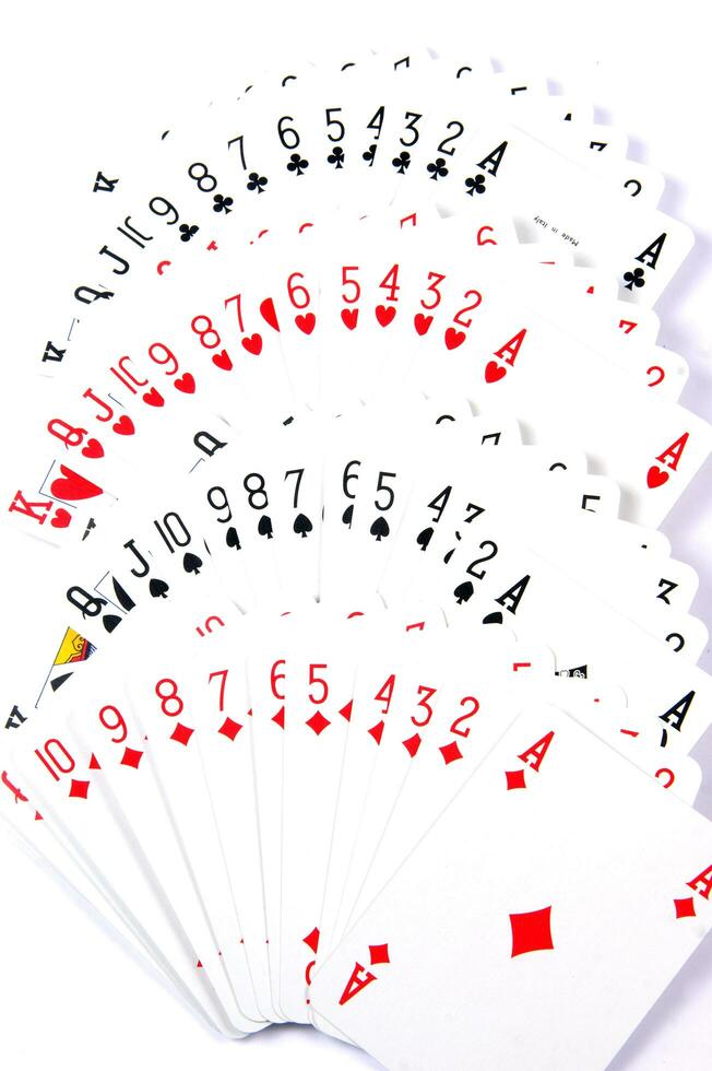 a pile of playing cards on a table photo