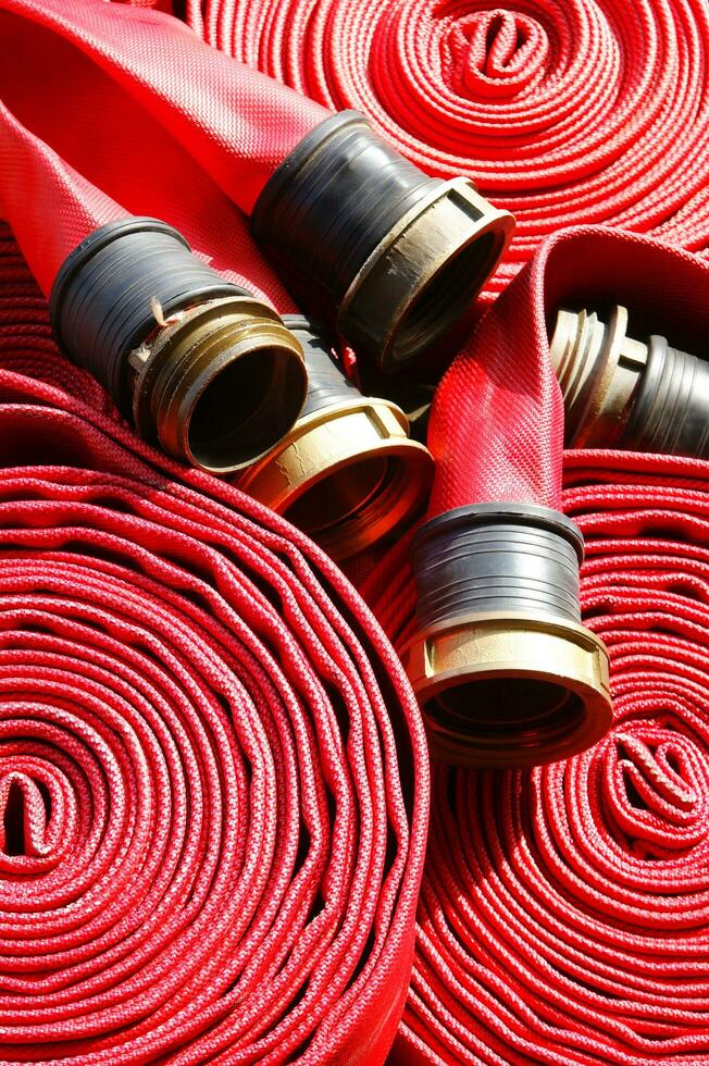 a close up of a red fire hose photo