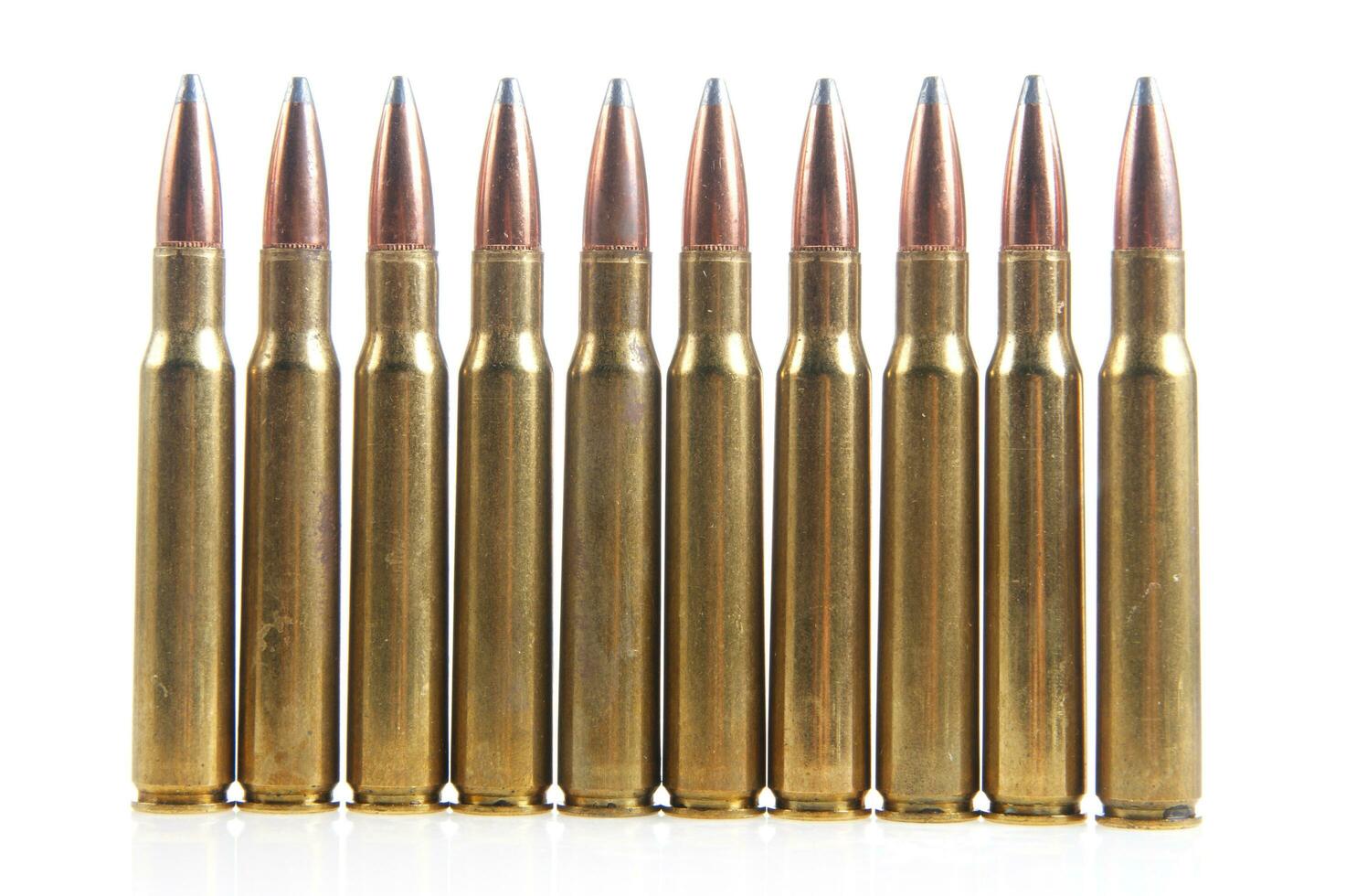 a row of bullet cartridges on a white background photo