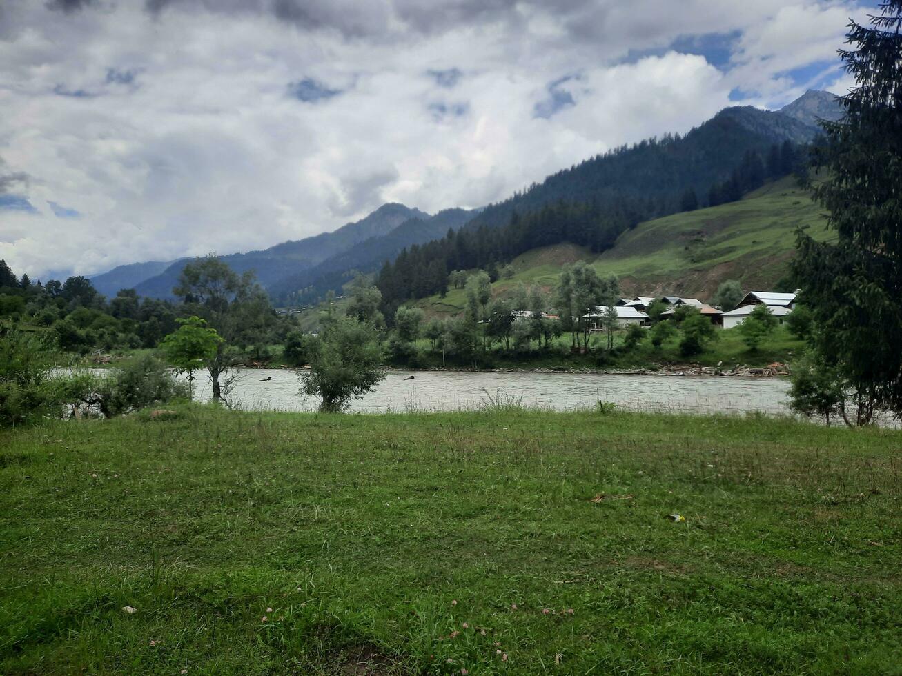 Scenic view of the natural beauty of Tao Butt, Neelum Valley, Kashmir.  Tao Butt is famous for its lush green trees and natural beauty. photo