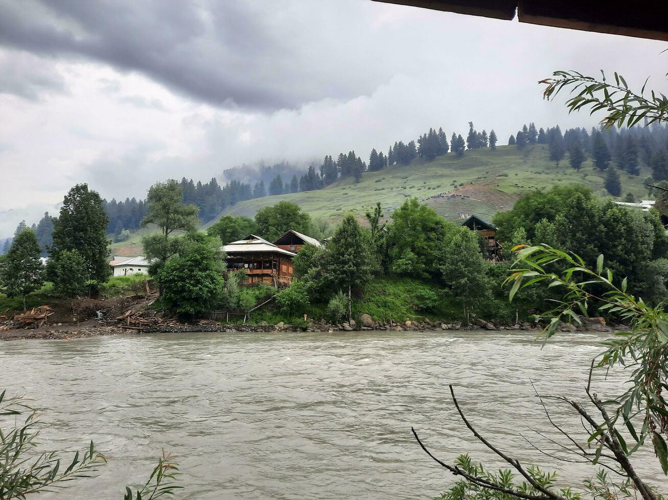 Scenic view of the natural beauty of Tao Butt, Neelum Valley, Kashmir.  Tao Butt is famous for its lush green trees and natural beauty. photo