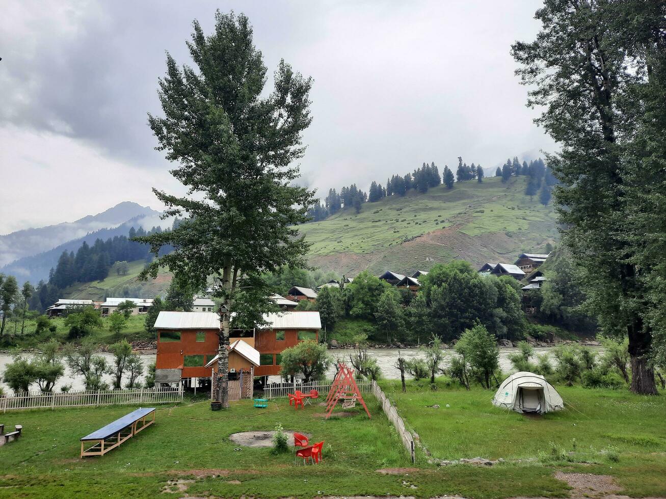 Scenic view of the natural beauty of Tao Butt, Neelum Valley, Kashmir.  Tao Butt is famous for its lush green trees and natural beauty. photo