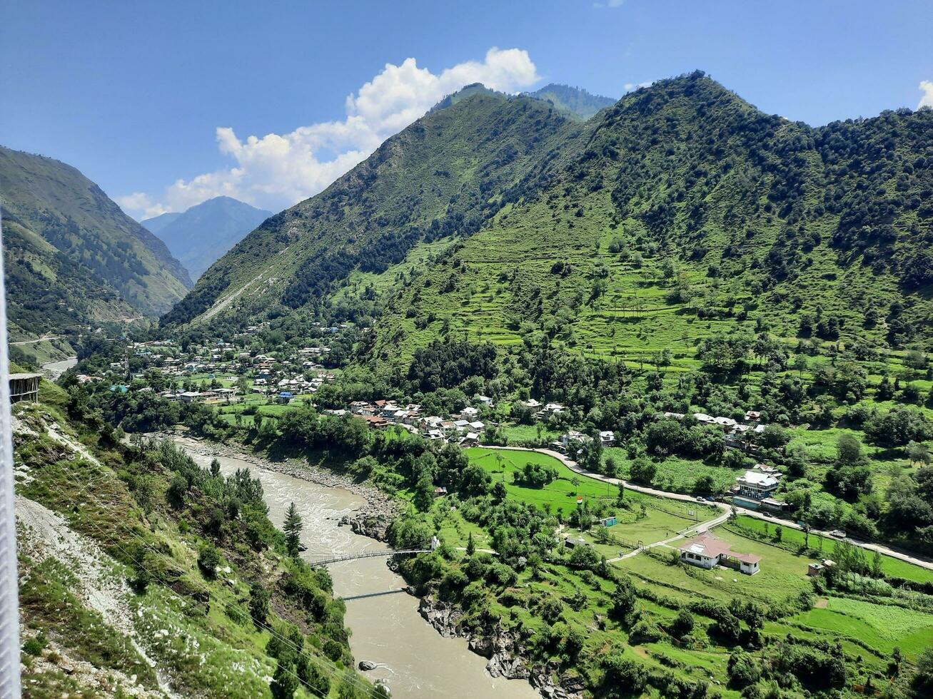 Beautiful day time view of Keran Valley, Neelam Valley, Kashmir. Green valleys, high mountains and trees are visible. photo