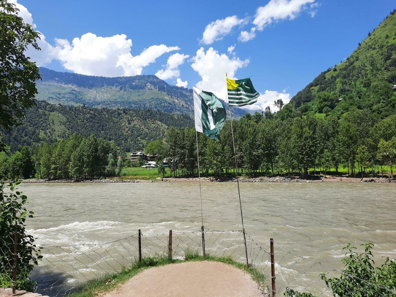Beautiful day time view of Keran Valley, Neelam Valley, Kashmir. Green valleys, high mountains and trees are visible. photo